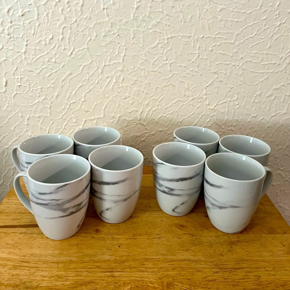 Set of 8 coffee mugs. White marble ceramic. Microwave and dishwasher safe.